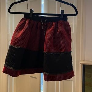 Red and black mini skirt in size Small.